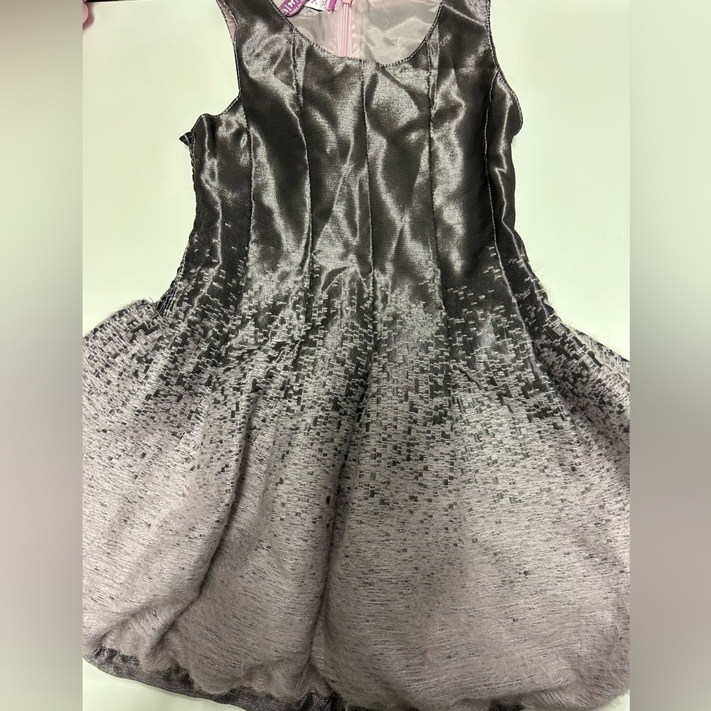 Purple sleeve less dress with cool design and zipper.